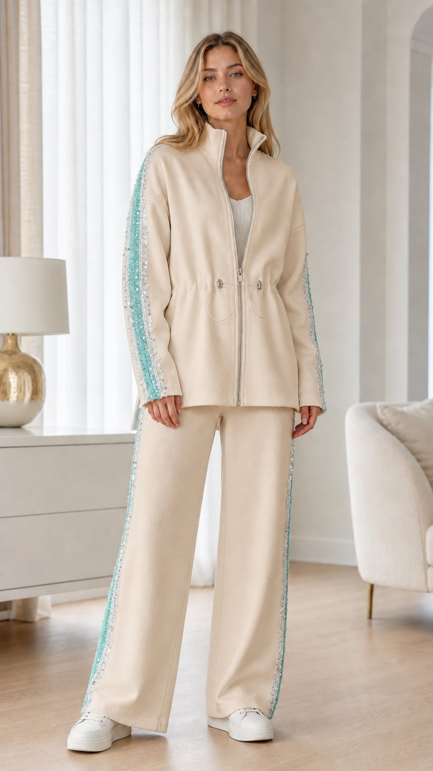Full-length view of woman wearing beige two-piece tracksuit set with side trim