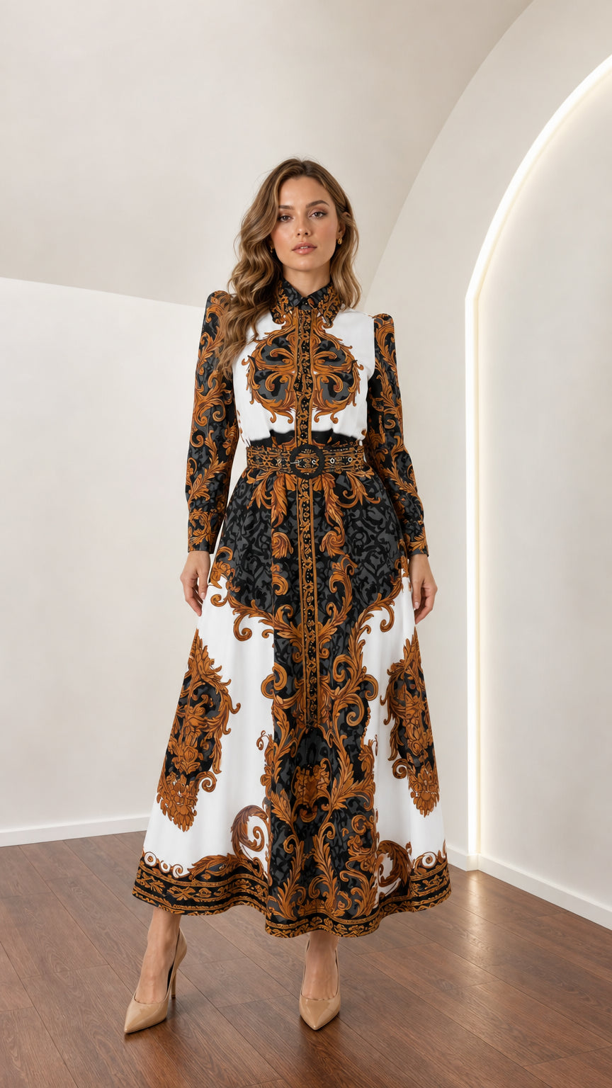Model wearing long sleeve white and gold baroque print shirt maxi dress with belt front view