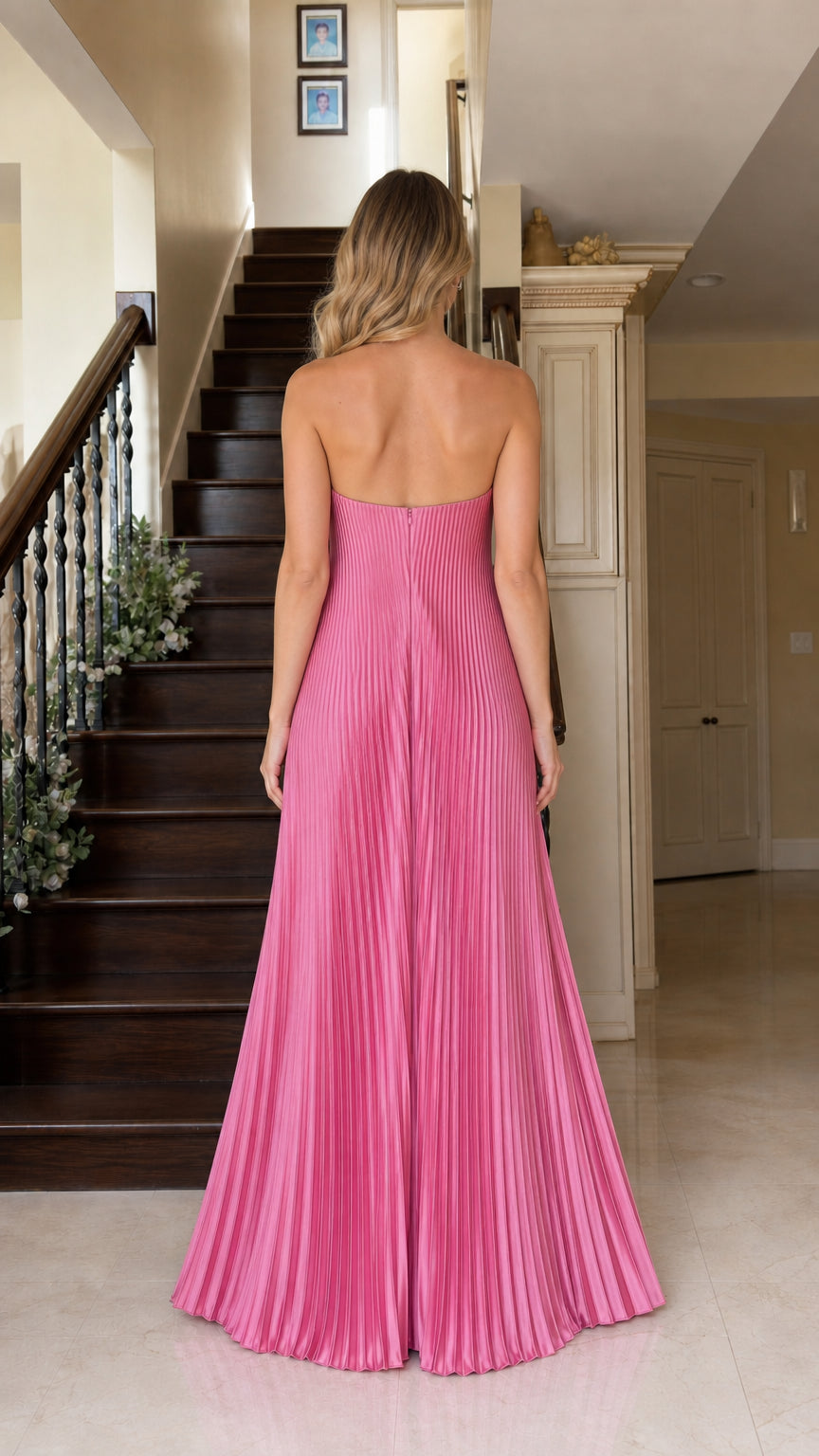 Back view of strapless floor-length pleated gown in fuchsia pink