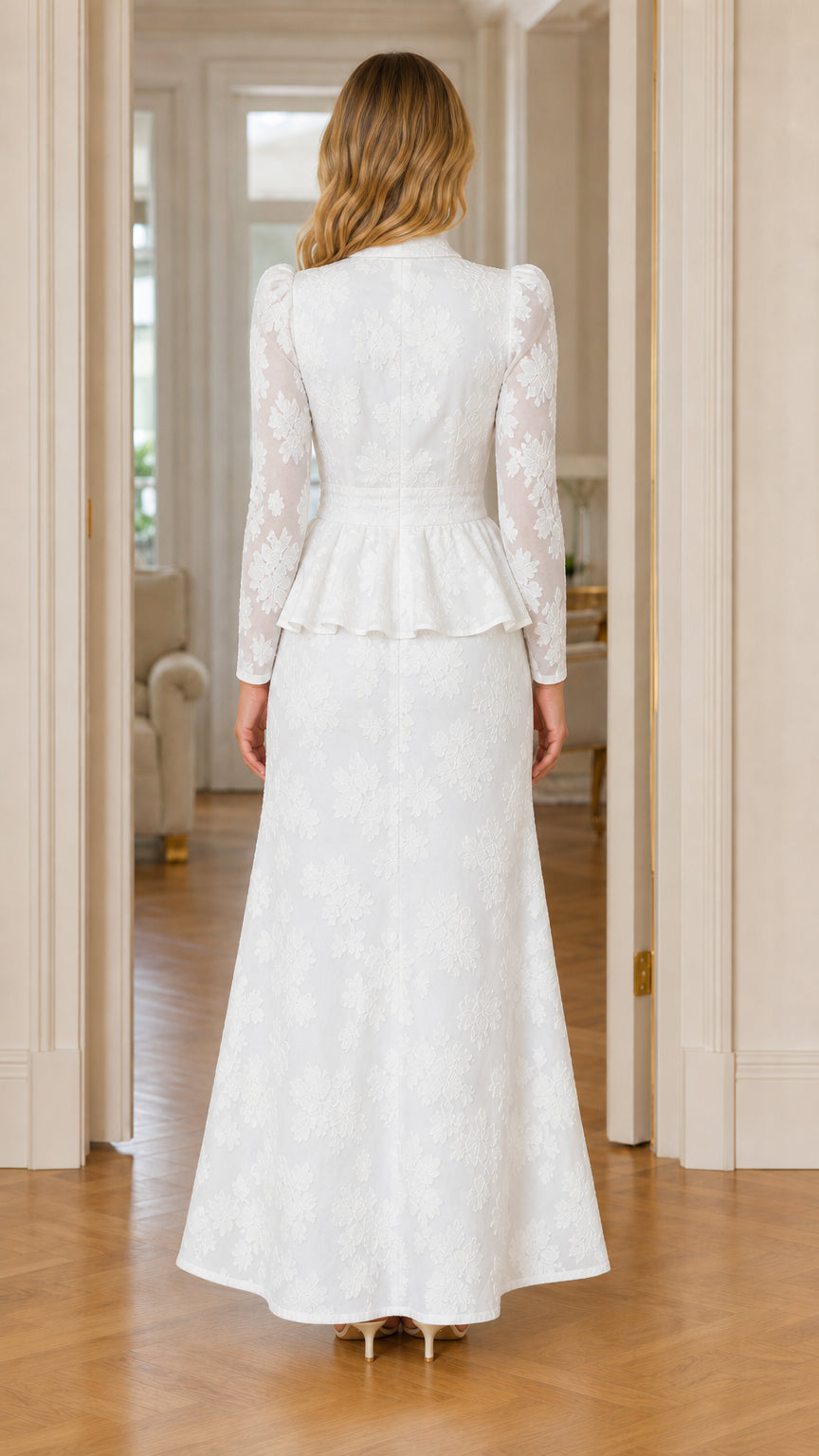 Back view of woman wearing white textured floral peplum maxi dress