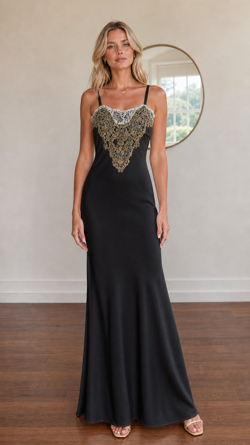 Model wearing black satin maxi dress with gold embroidered bodice