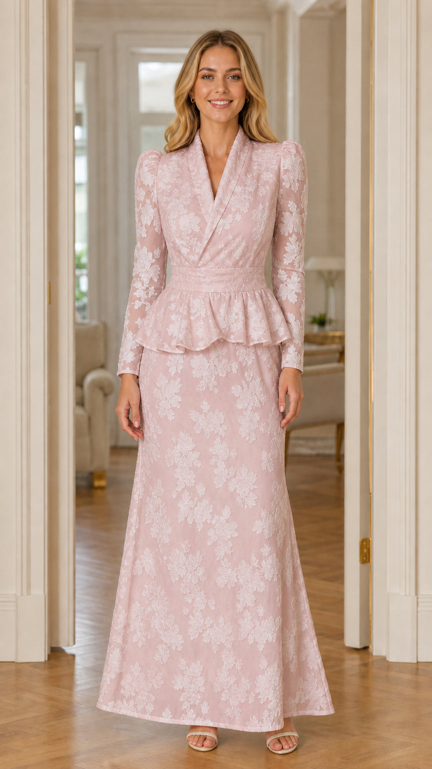 Front view of woman wearing blush pink long sleeve floral peplum maxi dress