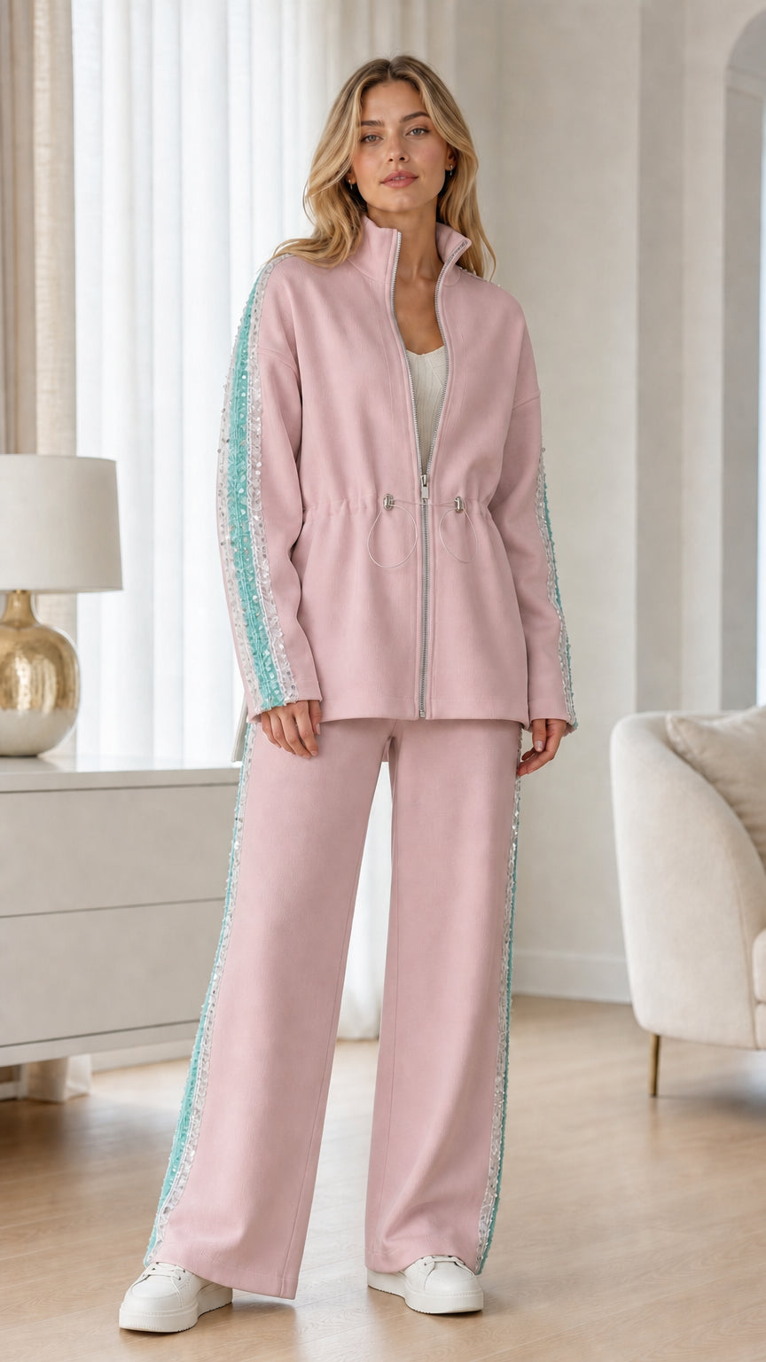 Full-length view of woman wearing blush pink two-piece tracksuit set