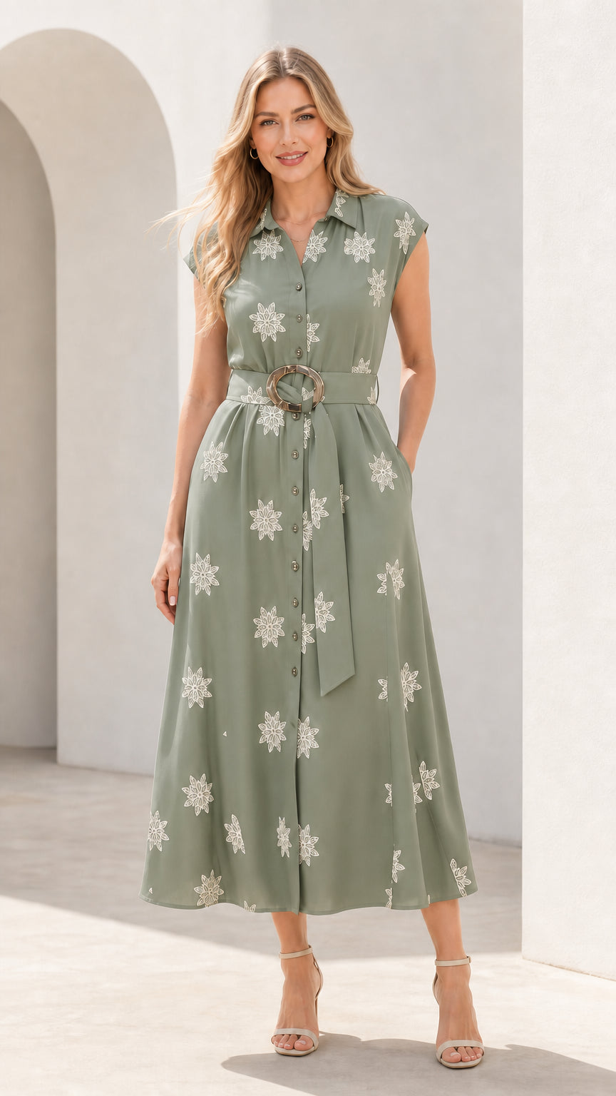 Front view of woman wearing sage green embroidered midi shirt dress