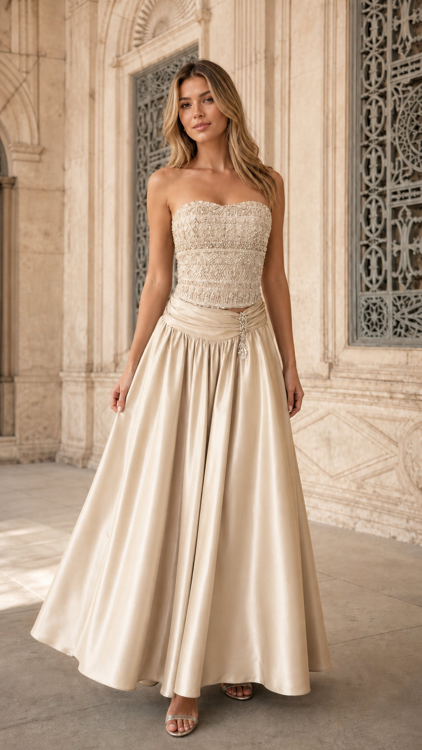 Model wearing champagne gold strapless embellished formal evening dress
